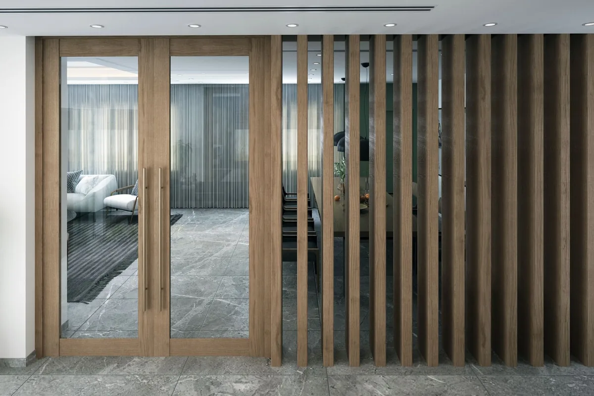 Oak slatted screen and glazed doors dividing a living space