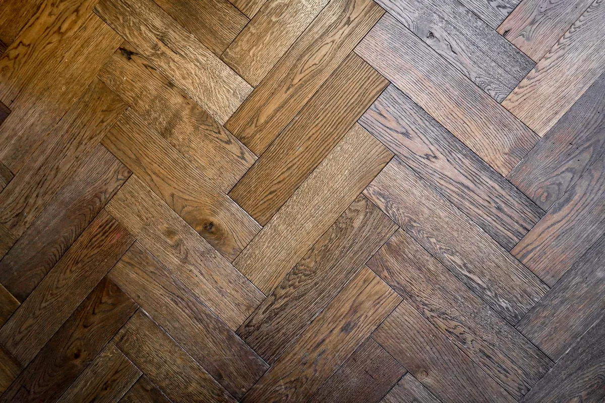 Herringbone oak parquet flooring laid across a room