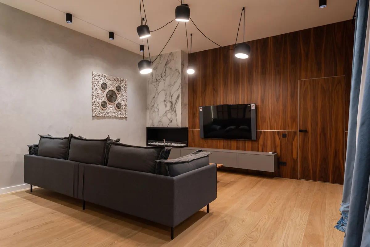 Timber-panelled feature wall with a fitted media unit
