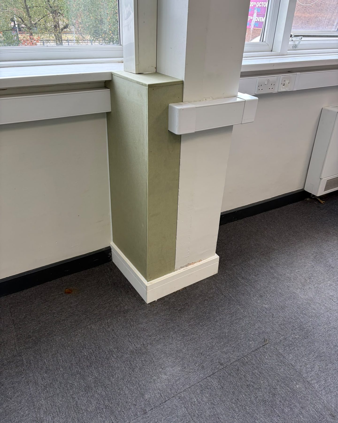 Structural column boxed in with moisture-resistant MDF, scribed to the skirting and window board